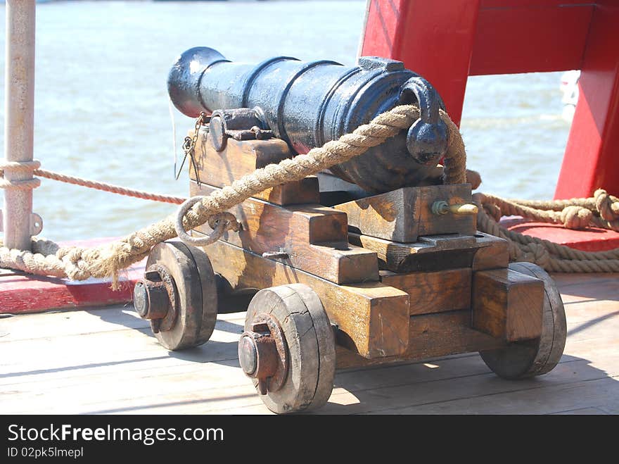 A six pound cannon on the deck of a British Man of War antique warship. A six pound cannon on the deck of a British Man of War antique warship.