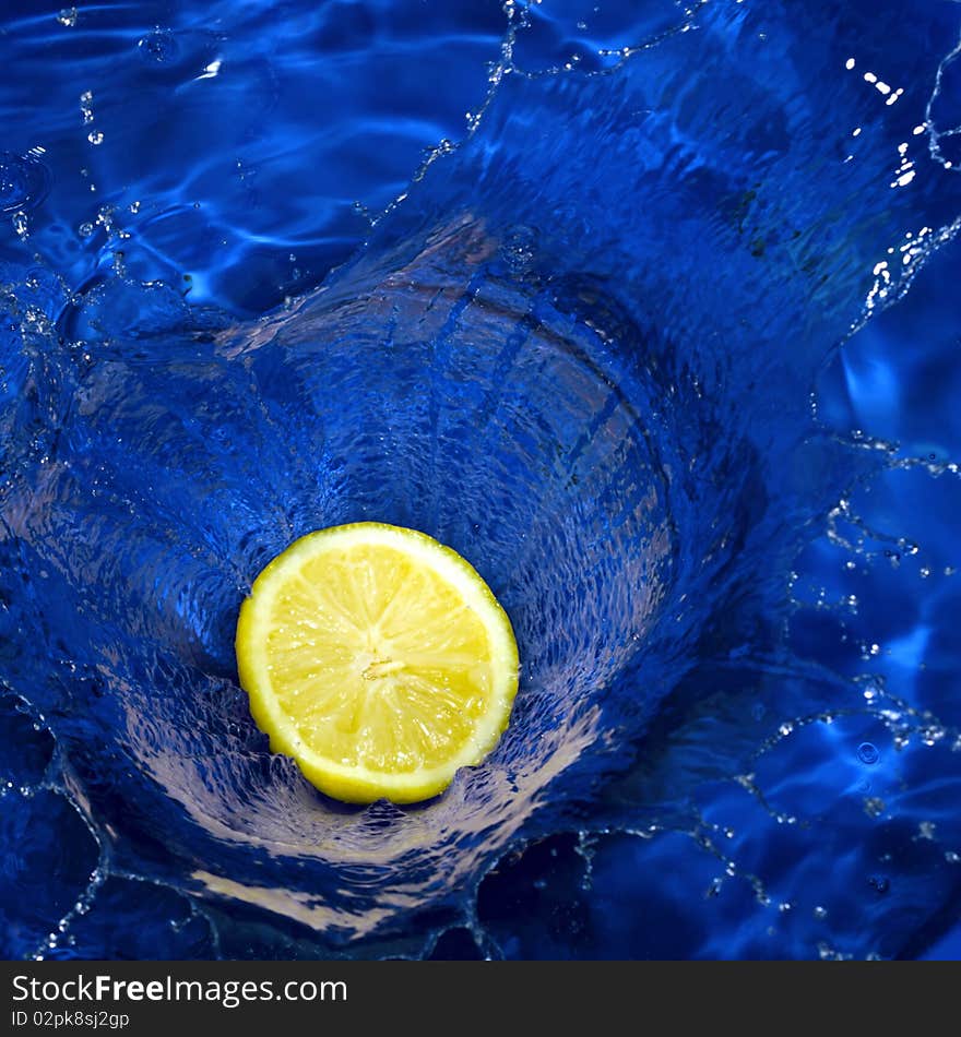 Lemon Splashing Blue Water