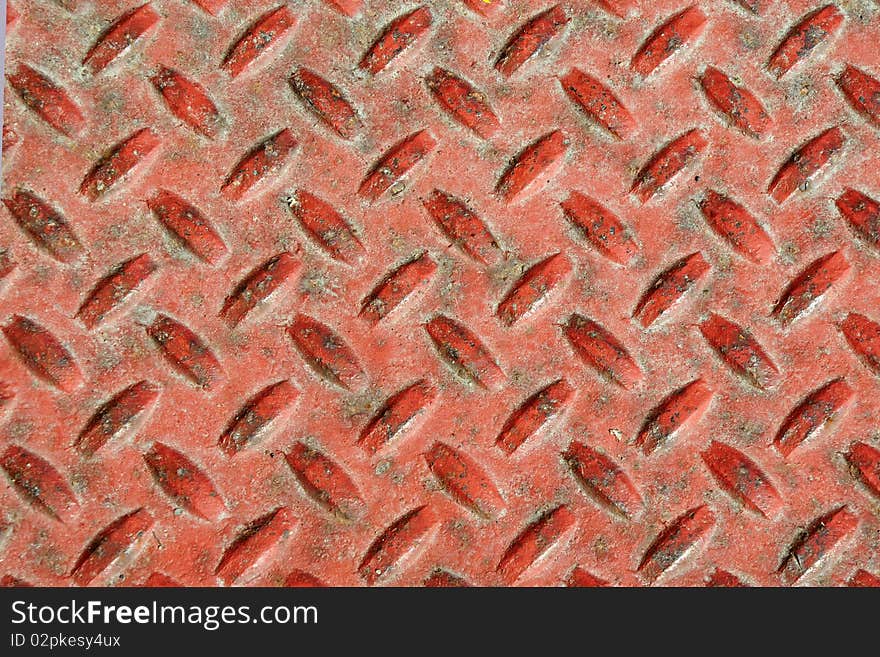 A walking orange and rusty tread in front of a business door. A walking orange and rusty tread in front of a business door.