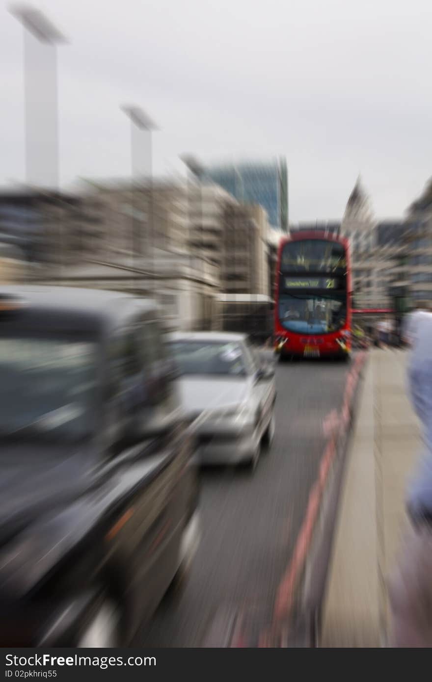 Zoom in on bright red London bus.