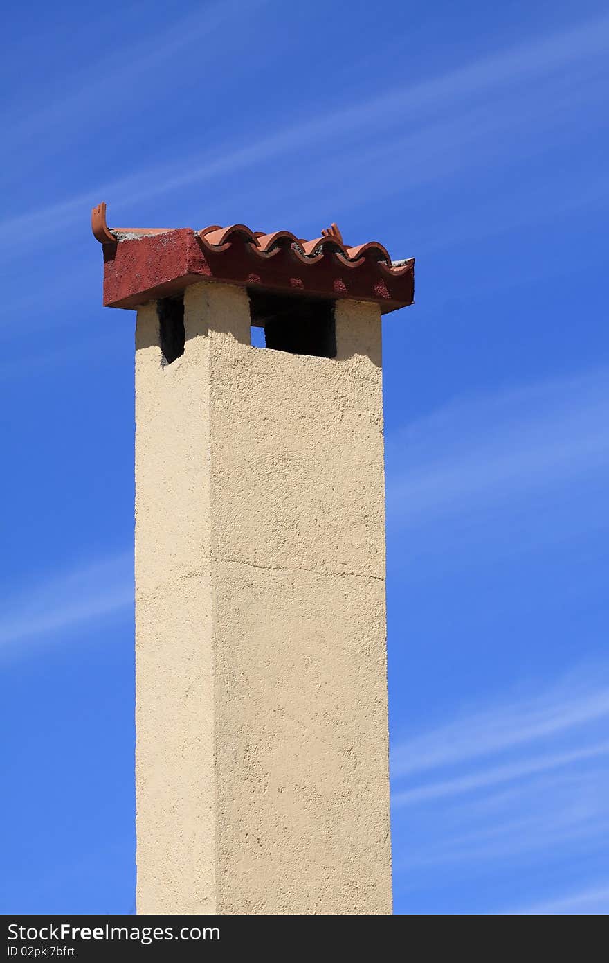 Withe chimney in the background blye sky.