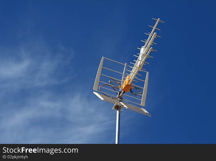 Antennas on the roof.In the background blue sky. Antennas on the roof.In the background blue sky.