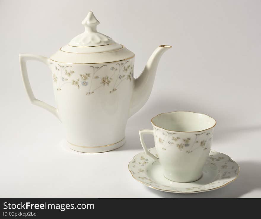 Ceramic teapot and a tea cup. Ceramic teapot and a tea cup.