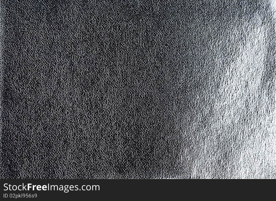 Dark synthetic leather textured background