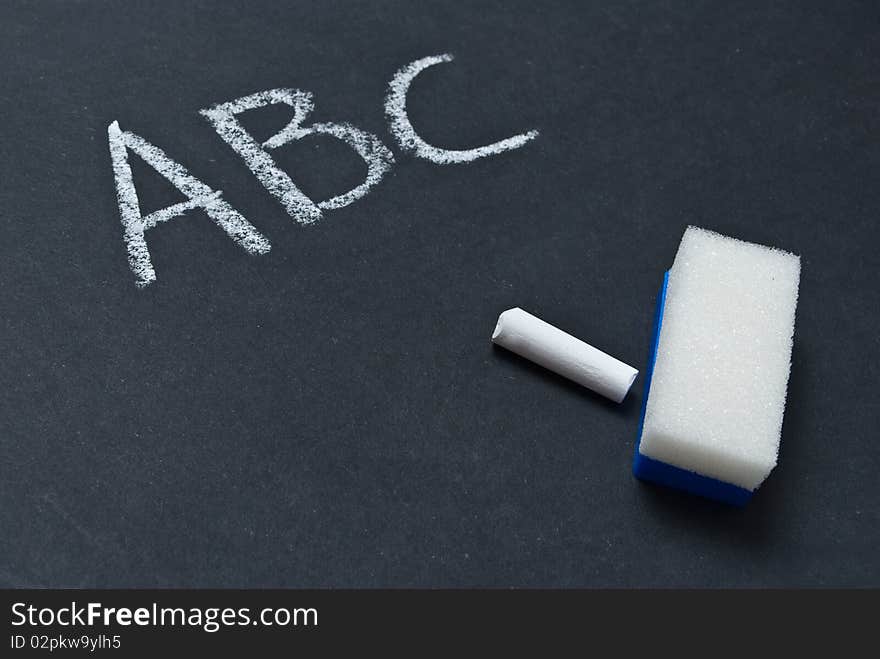 Blackboard with the first letters of the alphabet