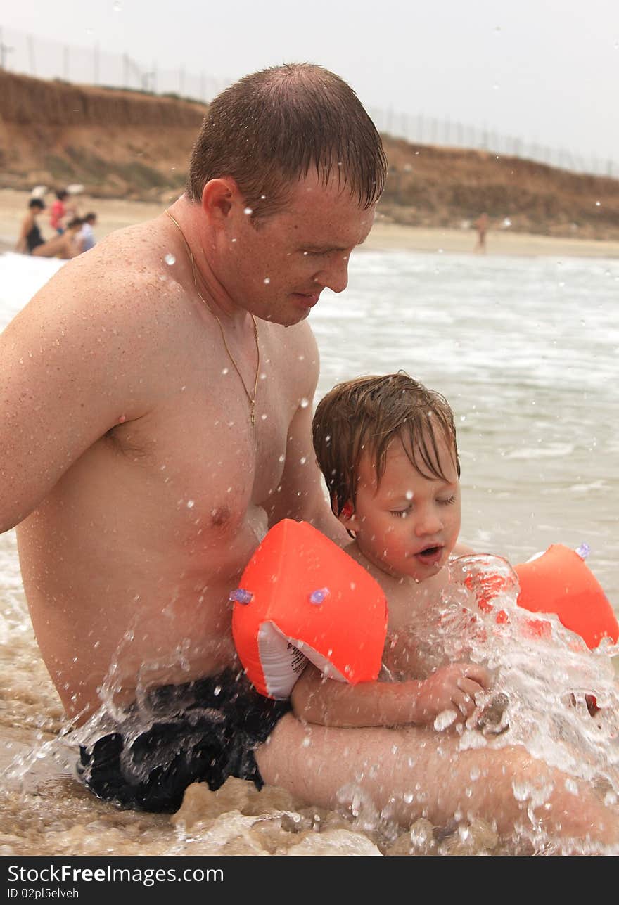 Father and son on the beach