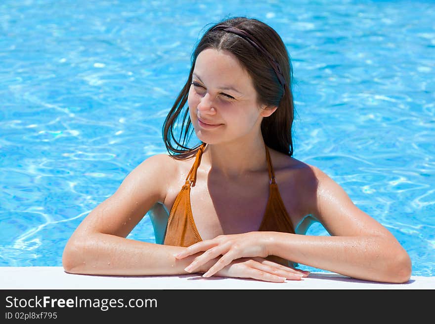 Young brunette woman in the pool. Young brunette woman in the pool