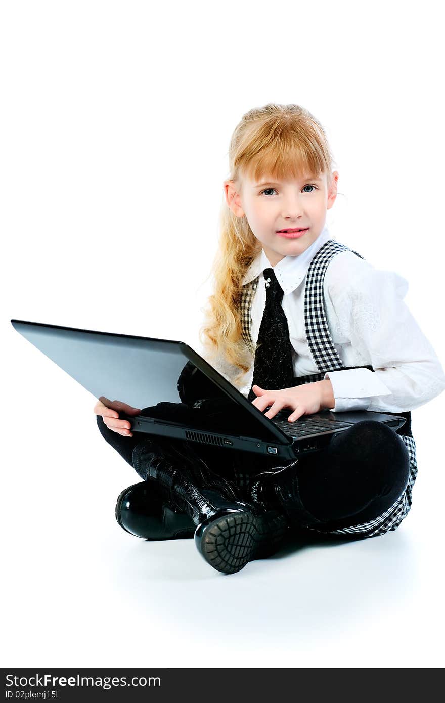 Shot of a little girl sitting on a floor with her laptop. Isolated over white background. Shot of a little girl sitting on a floor with her laptop. Isolated over white background.