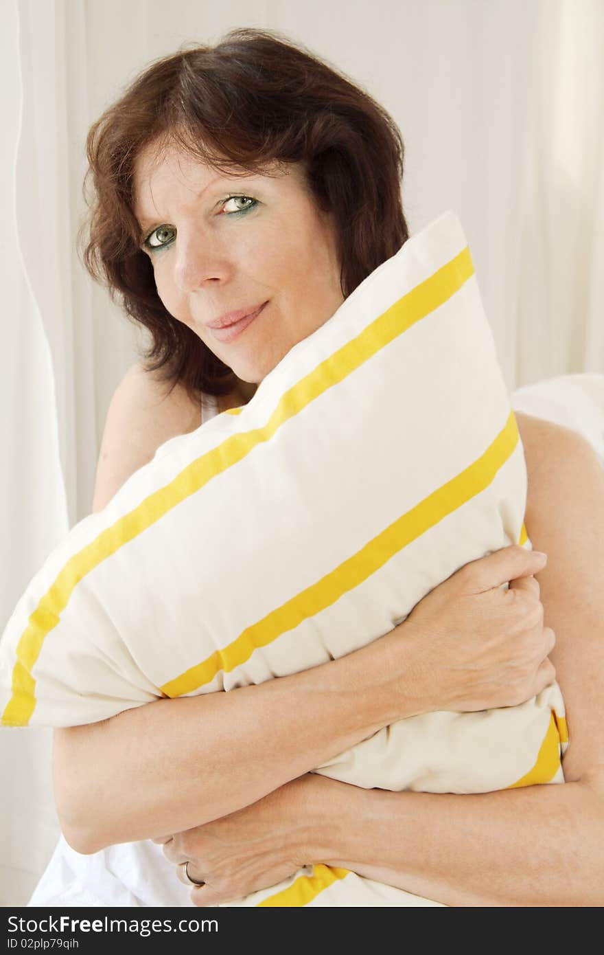 Woman portrait with striped pillow