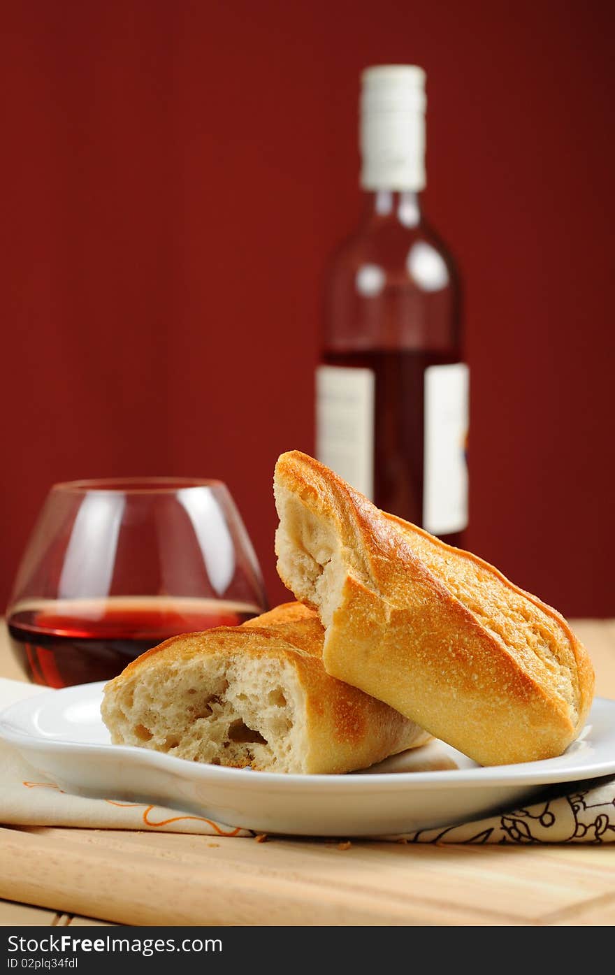 Fresh french bread served with red wine.