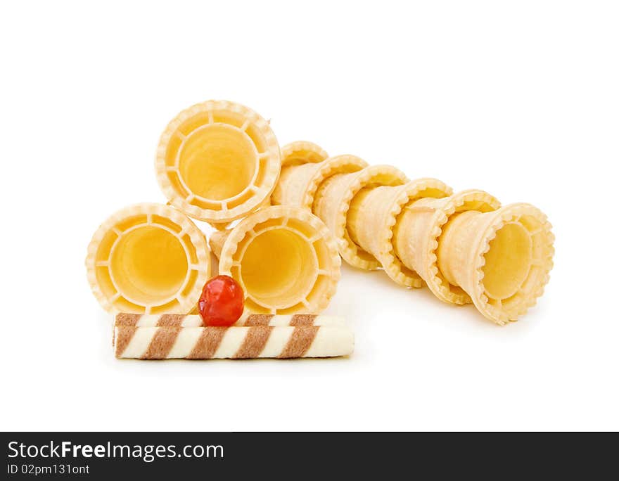 Empty ice cream cones with chocolate waffle and red cherry. Isolated over white background. Empty ice cream cones with chocolate waffle and red cherry. Isolated over white background.