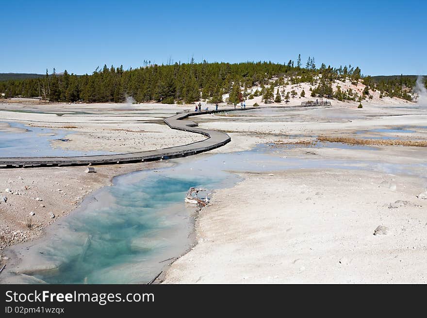 Visitors on the boardwalk at Yellowstone National Park's Porcelain Basin. Visitors on the boardwalk at Yellowstone National Park's Porcelain Basin.