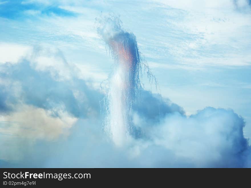 A pillar of smoke and sparks, growing out of the clouds. A pillar of smoke and sparks, growing out of the clouds