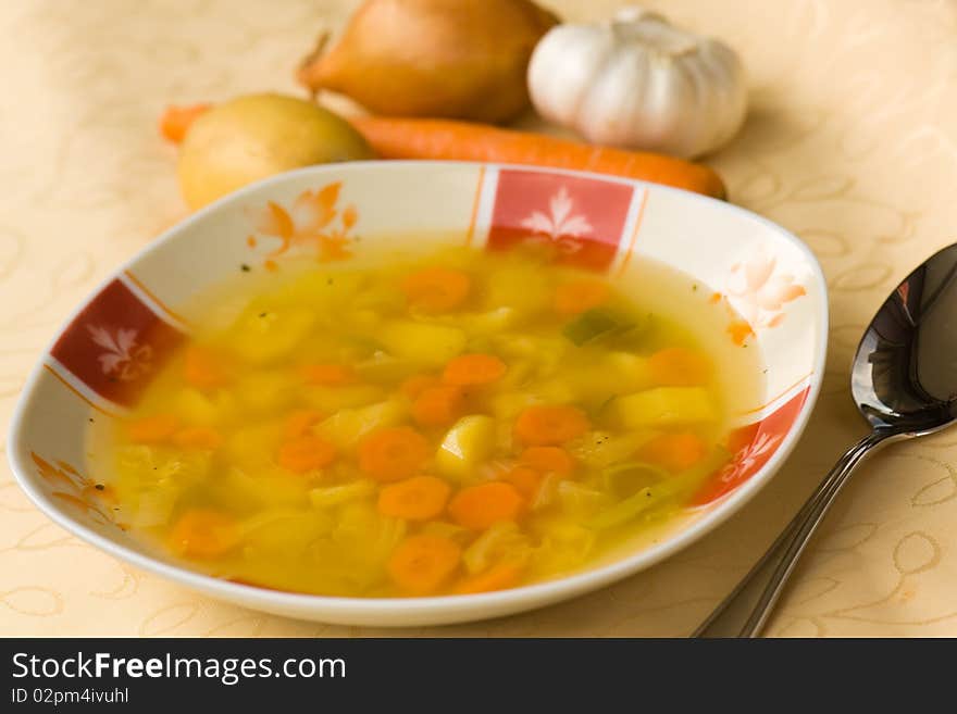 Soup with mixed vegetable , carrot , potato , pars