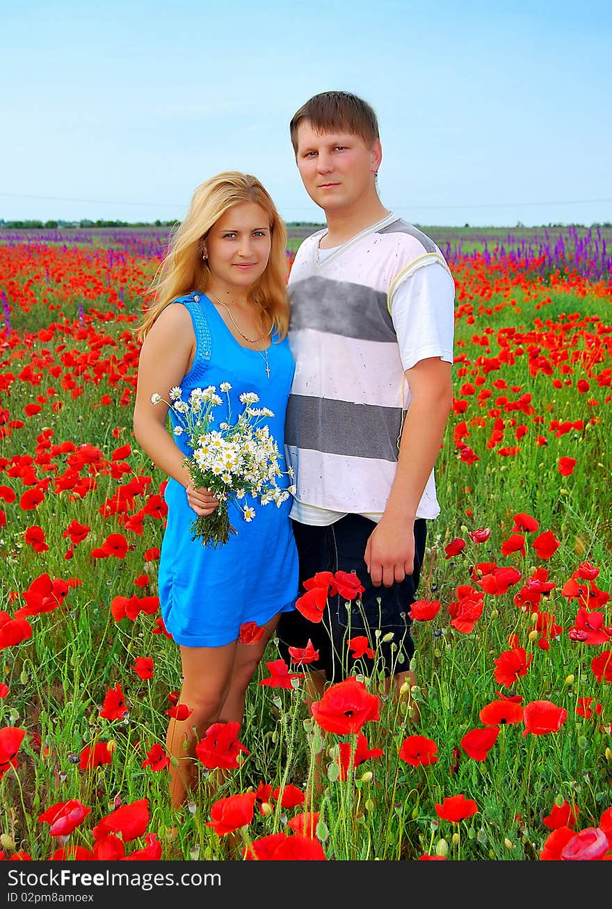 Loving couple in the meadow