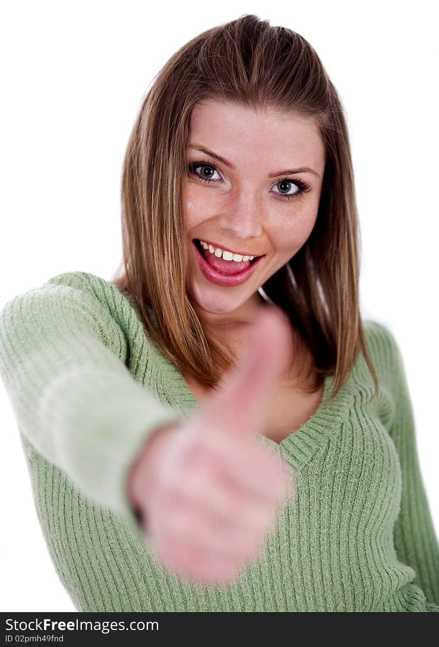 Smiling beautiful girl showing her thumps up over white background