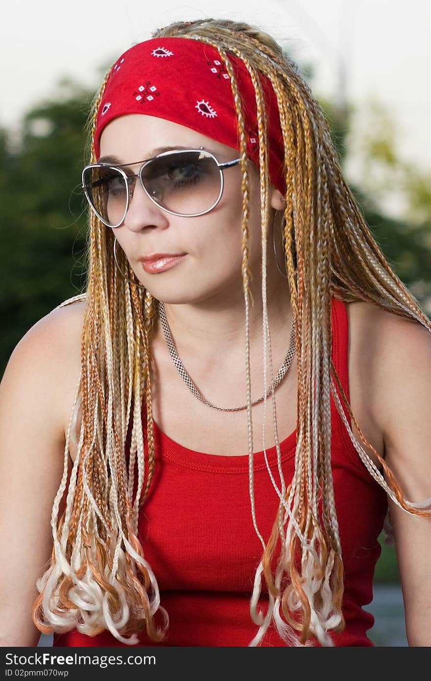 Rap-styled teen girl posing outdoors