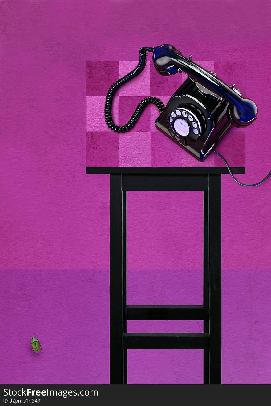 Old Telephone on grey table with pink and magenta textured background