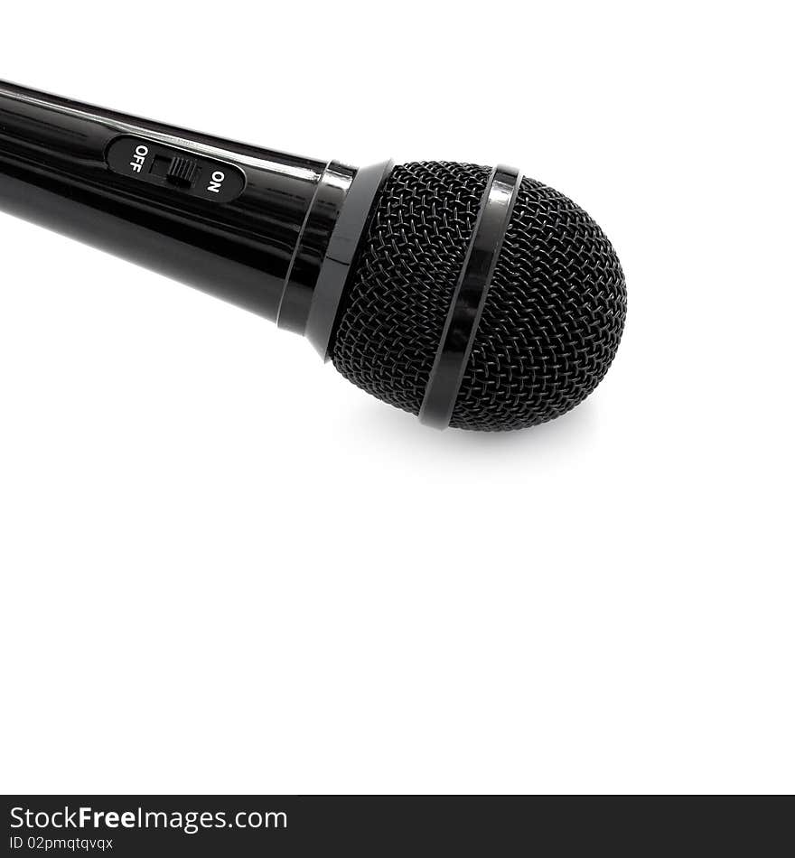 Black microphone isolated on a white background.