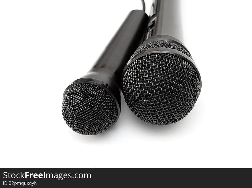 Two black microphones isolated on a white background.