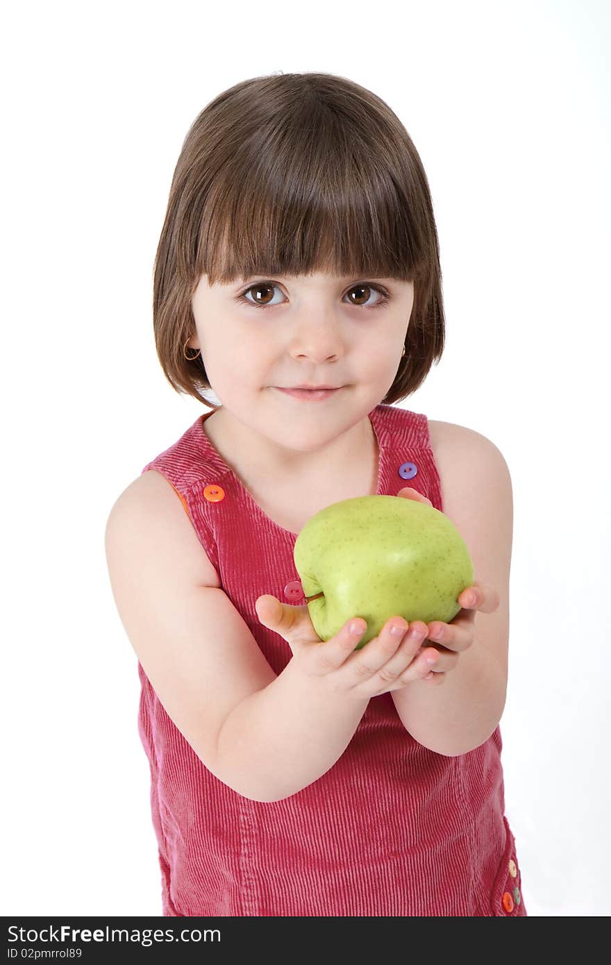 Three years old girl, holding an apple, smiling at the camera. Studio shot, professionally retouched. Three years old girl, holding an apple, smiling at the camera. Studio shot, professionally retouched.