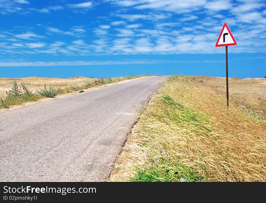 Road in desert and  traffic sign. Nature composition.