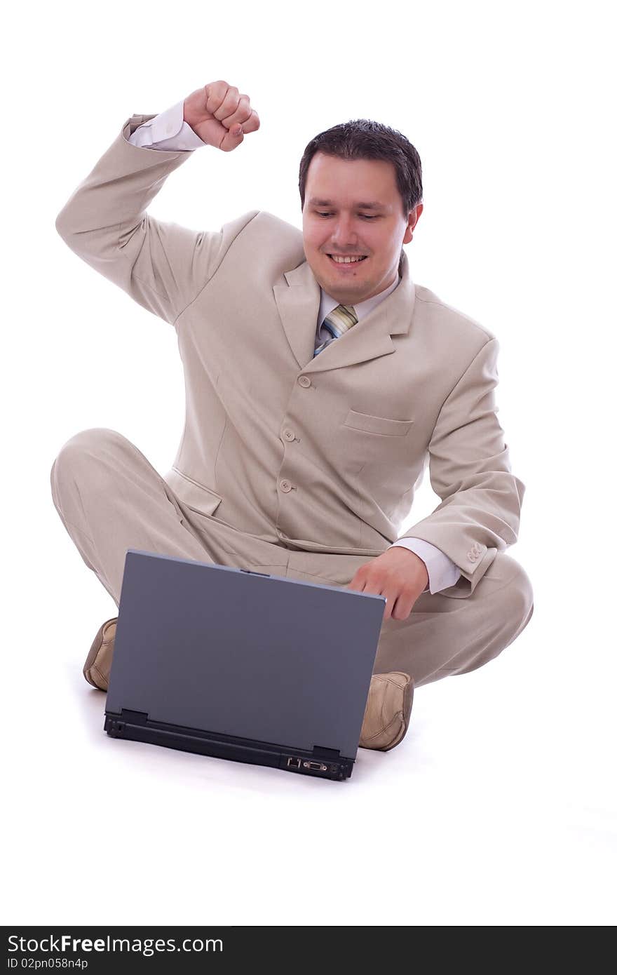 Excited caucasian 30s businessman alone over white background with computer. Excited caucasian 30s businessman alone over white background with computer