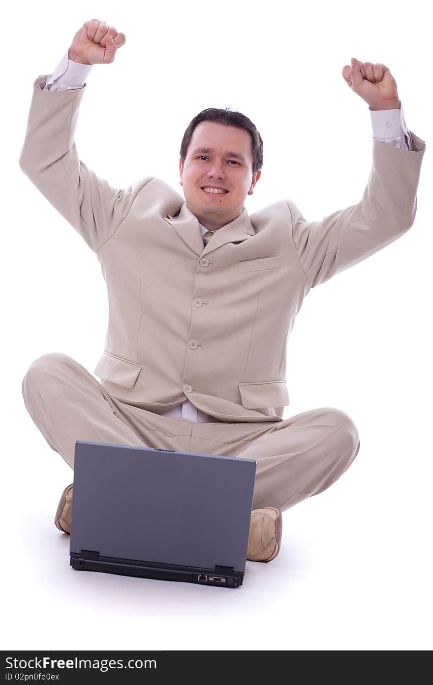 Excited caucasian 30s businessman alone over white background with computer. Excited caucasian 30s businessman alone over white background with computer