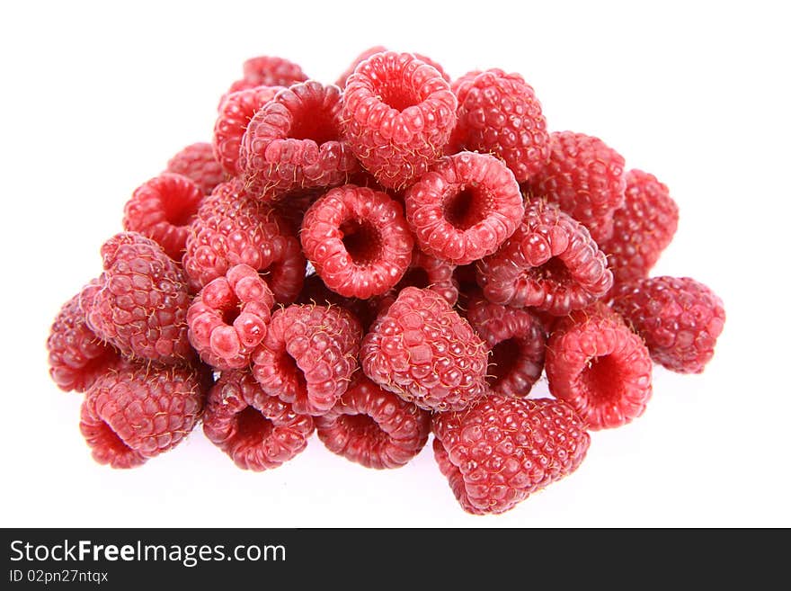 Raspberries: a stack of fruit on white background