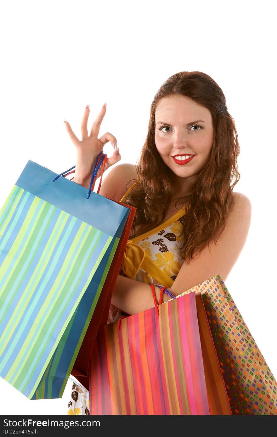 Pretty shopping girl with shoppingbags isolated on white background. Pretty shopping girl with shoppingbags isolated on white background