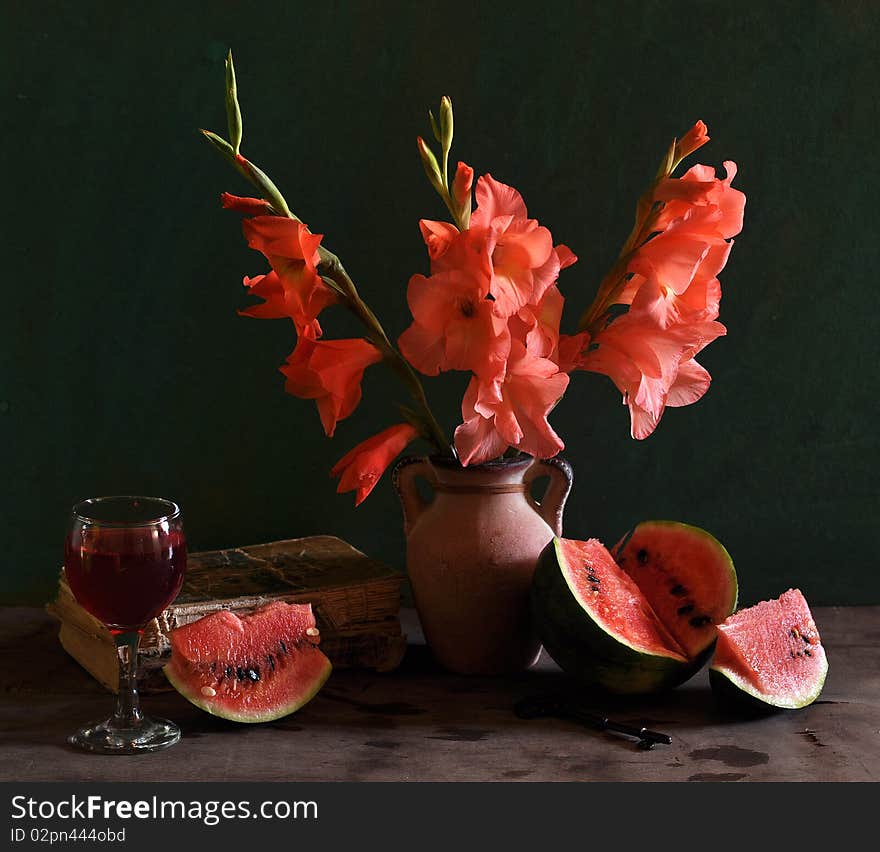 Still life with gladioluses and water-melon