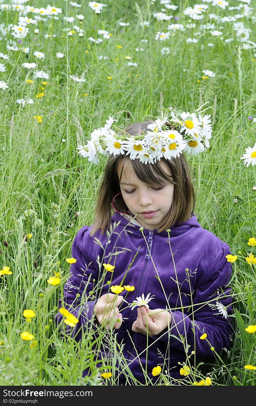 Beautiful Teenager Counting Petals In Grass