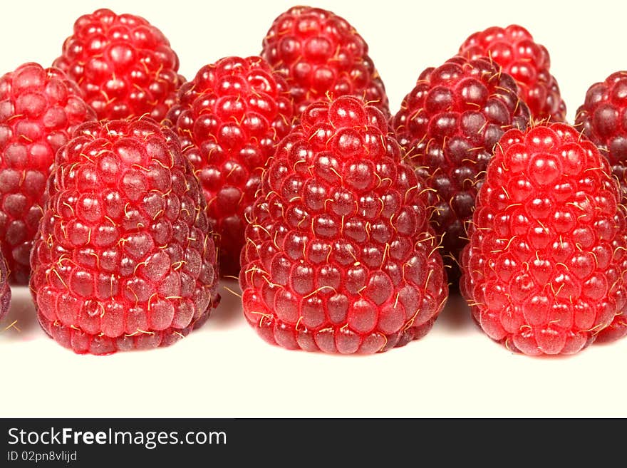 A group of big fresh raspberries over white. A group of big fresh raspberries over white