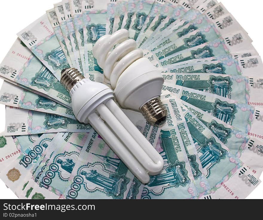 Energy saving bulb on the banknote background