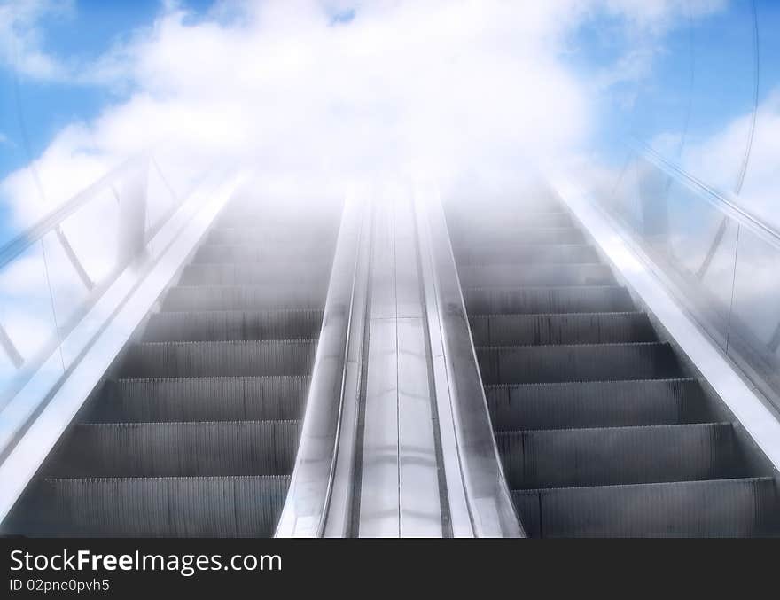 Moving escalator goes up to the light. Moving escalator goes up to the light