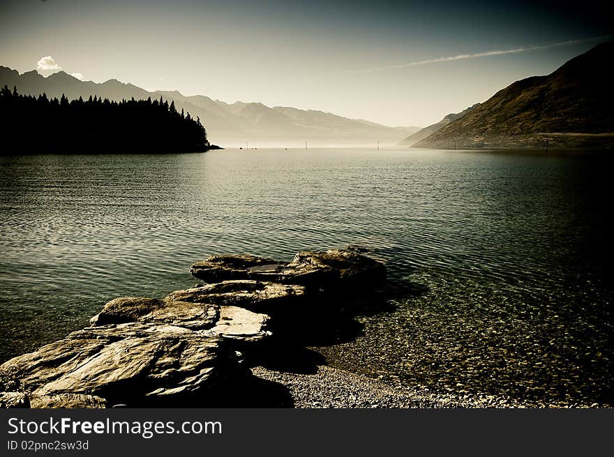 Panoramic landscape view of mountain lake and  blue sky. Panoramic landscape view of mountain lake and  blue sky.