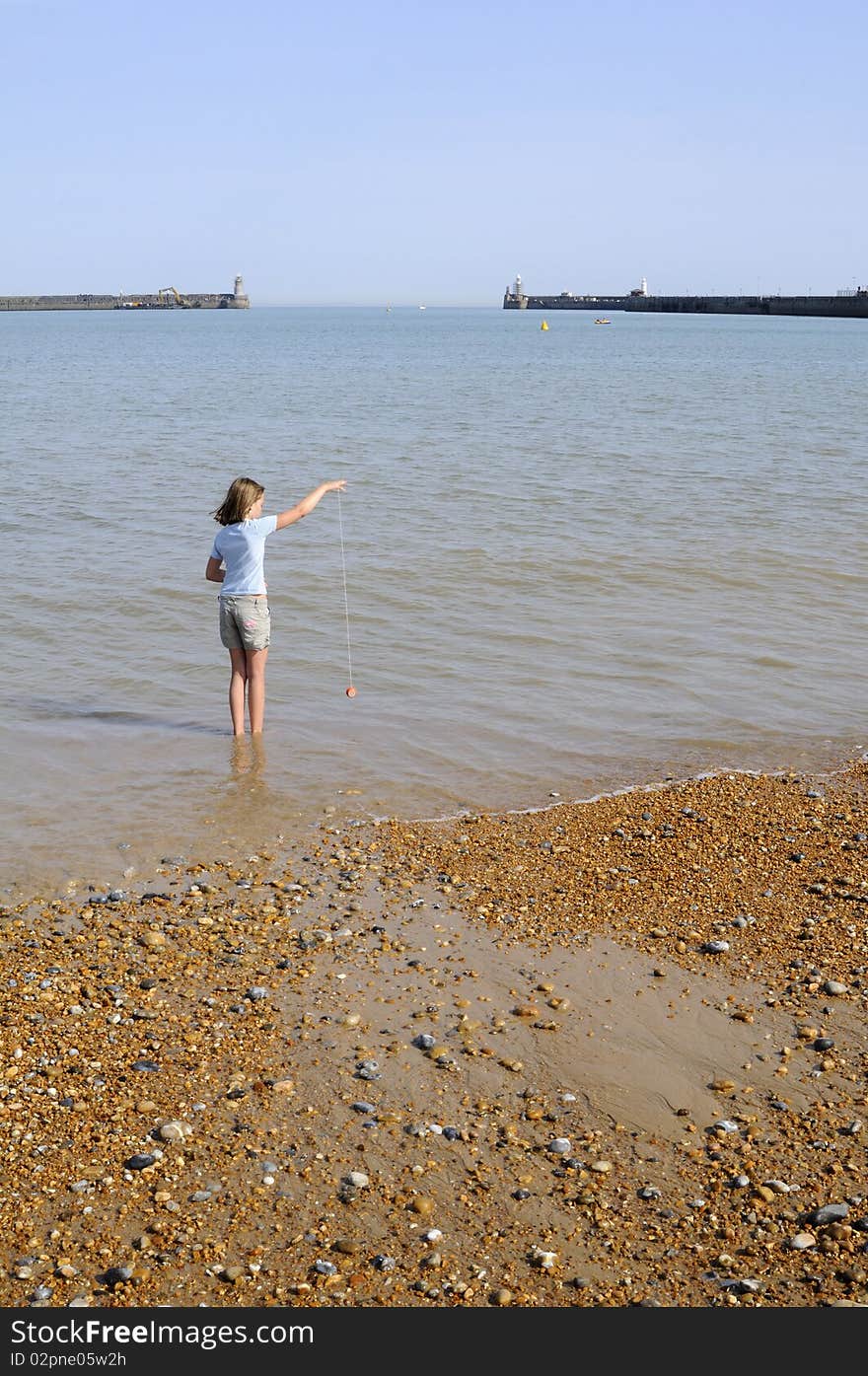 White girl playing in english channel Dover UK