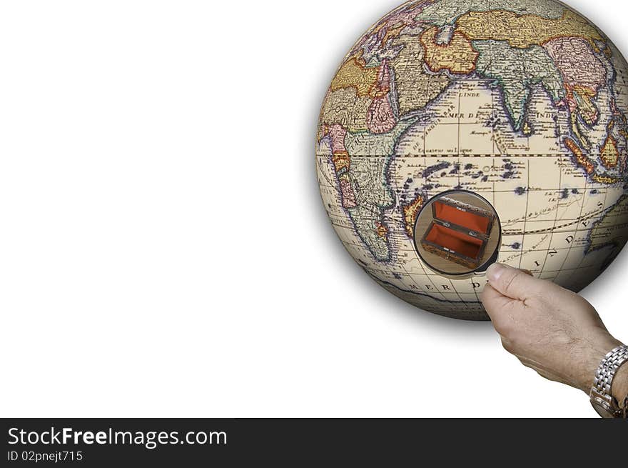 This image shows a globe. A hand with a magnifying glass shows a detail of the globe, namely an empty box. This image shows a globe. A hand with a magnifying glass shows a detail of the globe, namely an empty box.