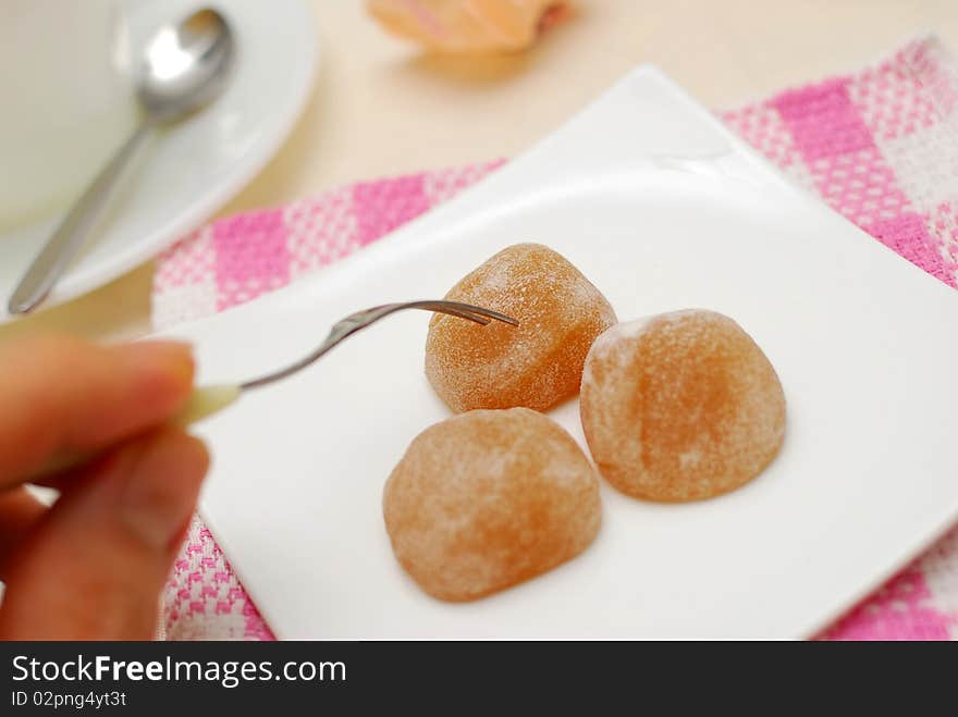 Fork taking sweets on plate. For concepts such as food and beverage, diet and nutrition, and healthy lifestyle.