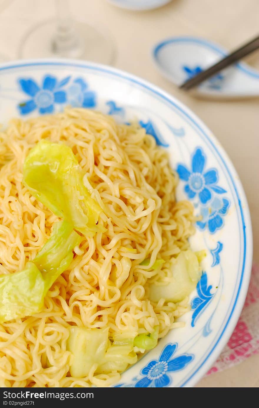 Chinese vegetarian yellow noodles. Suitable for concepts such as diet and slimming, healthy lifestyle, and food and beverage. Chinese vegetarian yellow noodles. Suitable for concepts such as diet and slimming, healthy lifestyle, and food and beverage.
