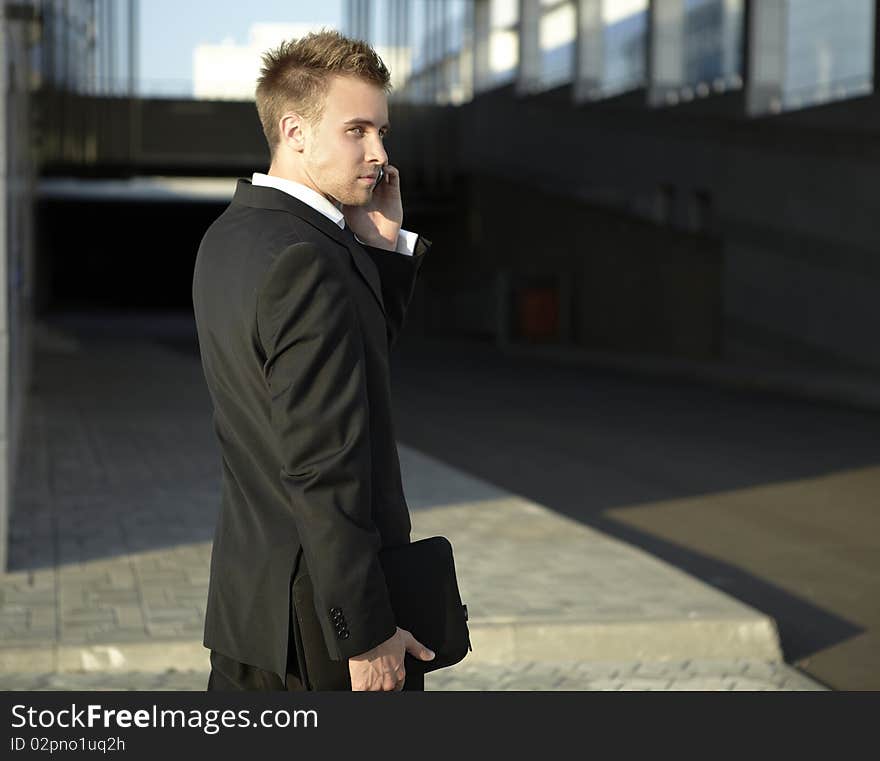 Businessman with phone on the street. photo. Businessman with phone on the street. photo