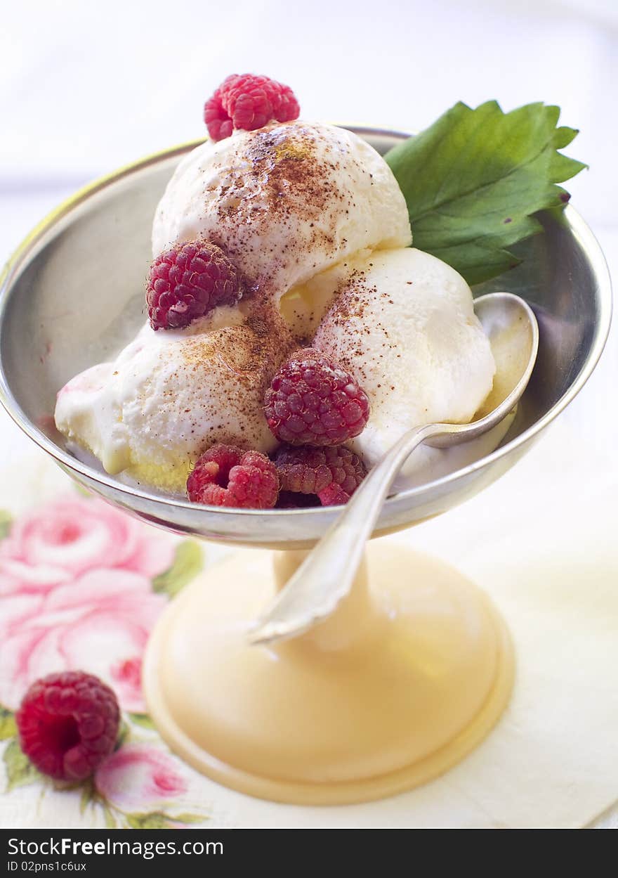 Vanilla ice cream with fresh raspberries