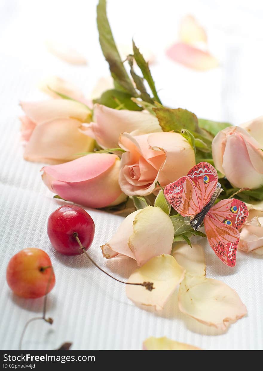 Beautiful pink roses with butterfly and cherry