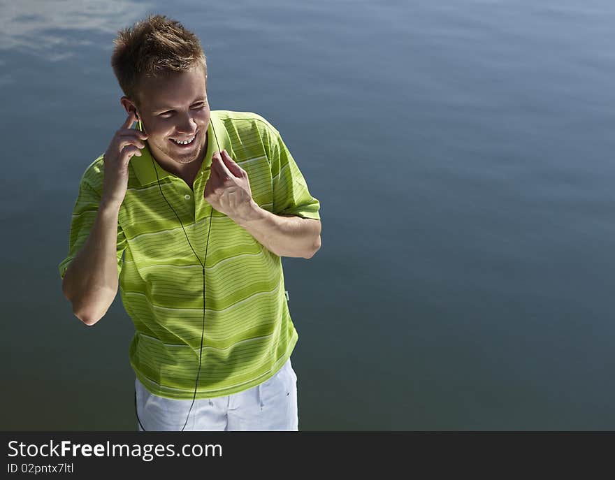 Cheerful guy in a green vest.