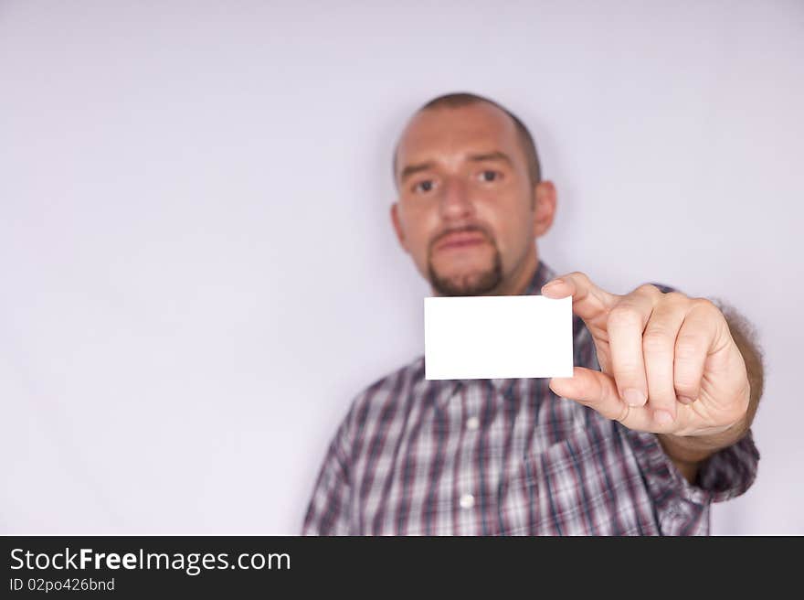 Portrait of a nice man with shirt and blank business card. Portrait of a nice man with shirt and blank business card