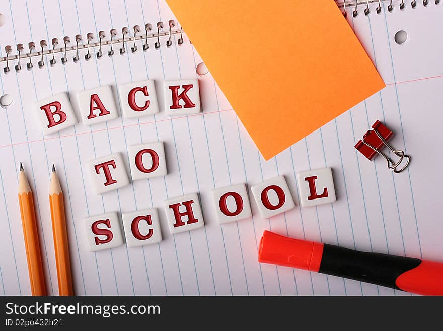 School writing-book with text Back to School and school subjects.