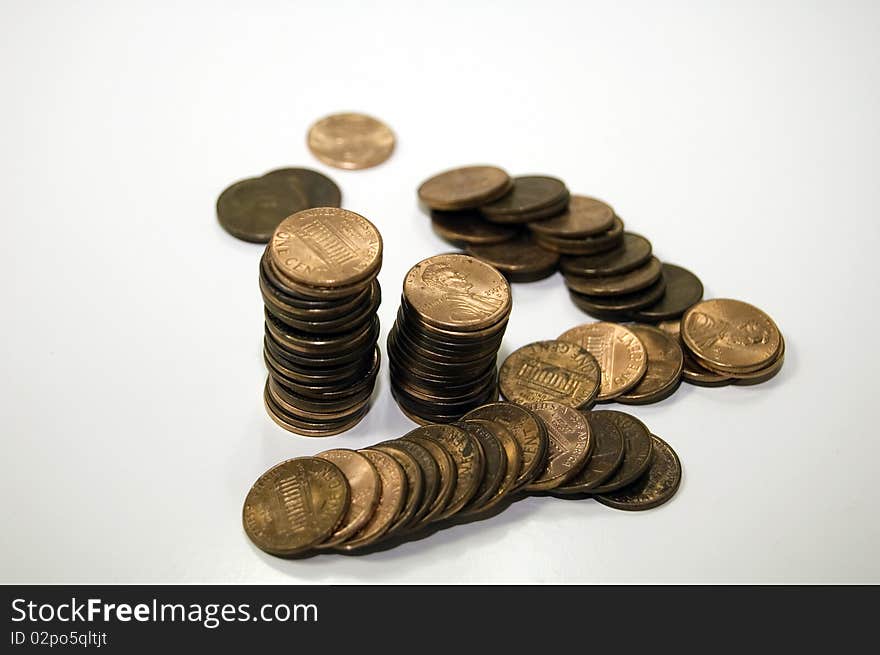 Stacks and piles of pennies to save. Stacks and piles of pennies to save