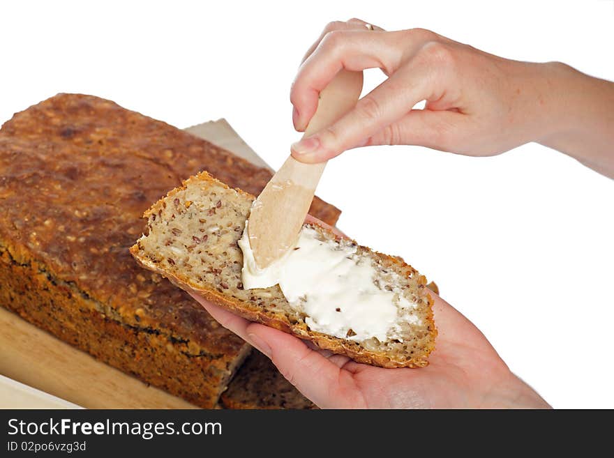 Hand Bread Slices On A Board With A Knife