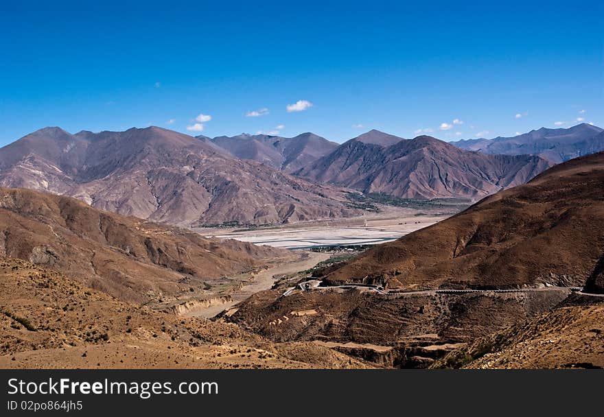 Yellowish mountain road view in tibet of China