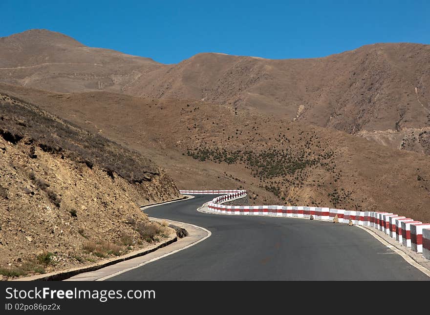 Yellowish mountain road view in tibet of China